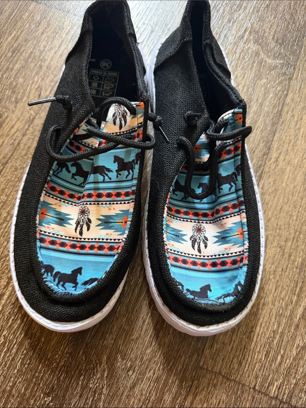 Black Canvas Slip-On Shoes with Turquoise Aztec Horse Print